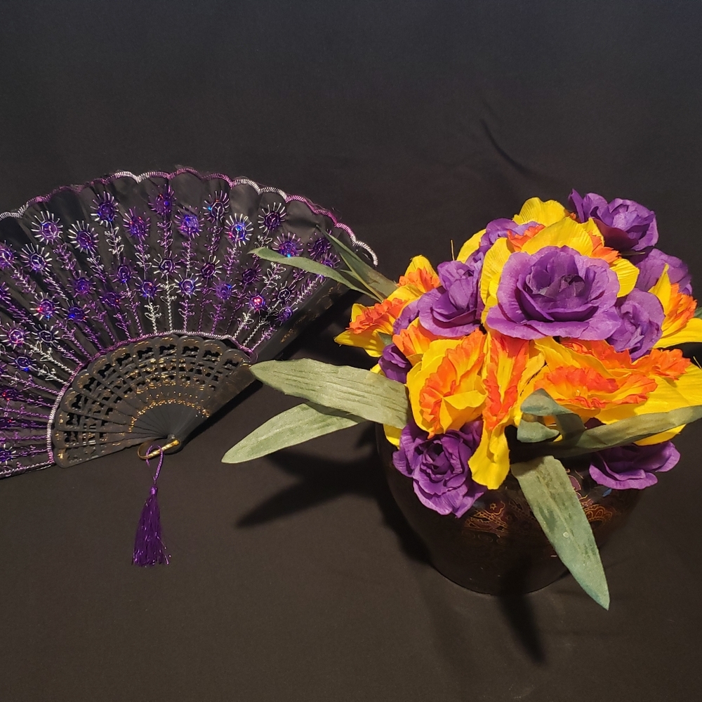 Colorful vase with artificial flowers.